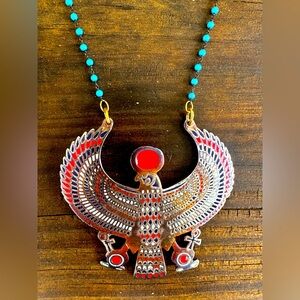 Horus pendant necklace on turquoise beads. Egyptian god of protection.